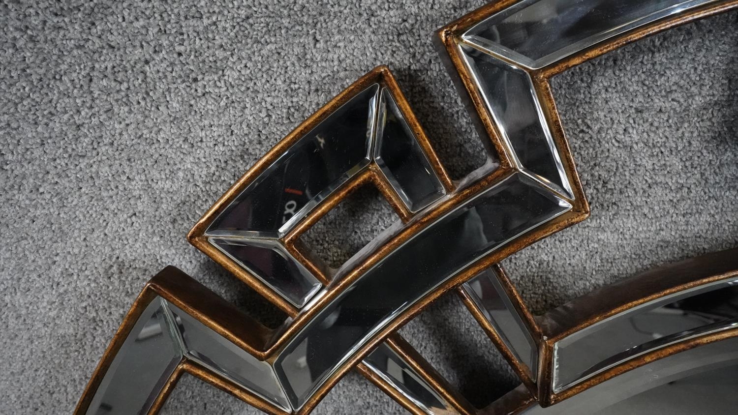 A contemporary circular bevelled glass wall mirror in gilt and glazed geometric styled frame. H. - Image 2 of 4