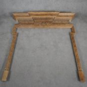 A George II mid 18th century pine breakfront chimney piece architrave carved with acanthus, egg