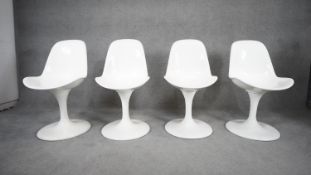 A set of four vintage Eero Saarinen style swivel chairs on tulip bases. H.88 W.46 D.50 (marks and
