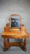 A Victorian satin birch Duchess style dressing table fitted with an arrangement of drawers. H.154