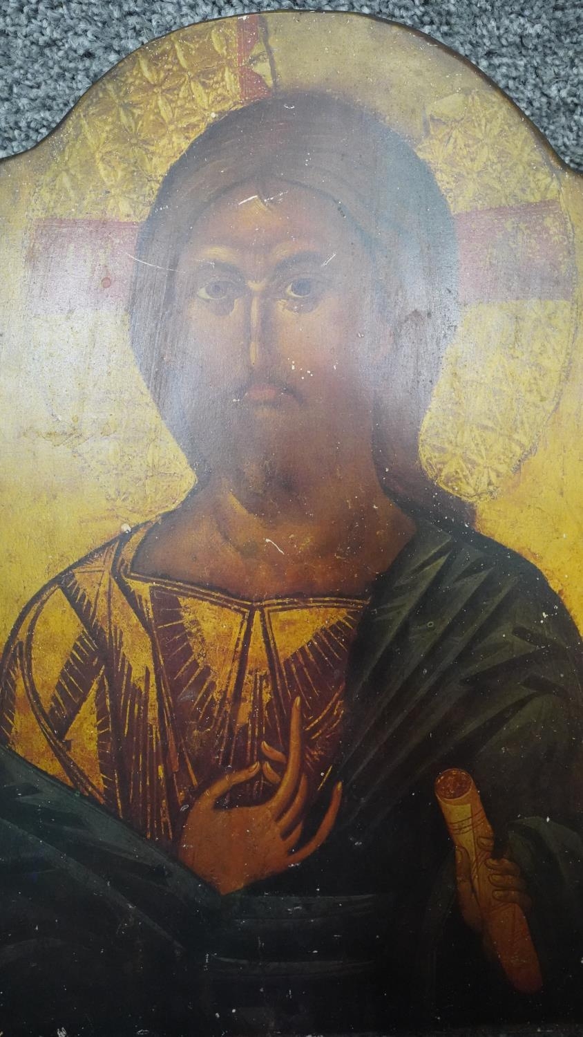 A copy of a early religious icon printed on wood with inscription to the back. H.39 W.26
