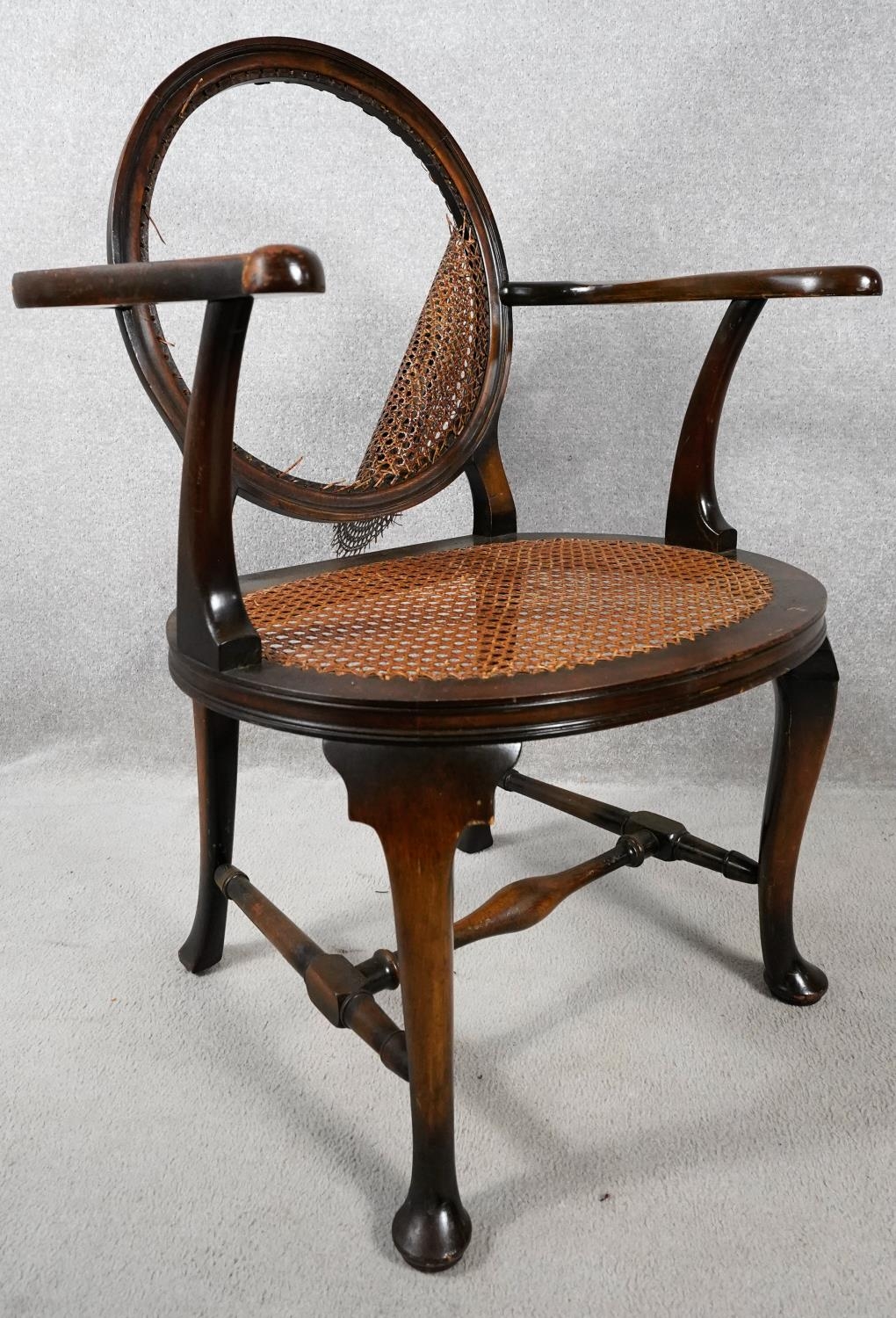 An early 20th century mahogany framed office armchair with caned back and seat on stretchered - Image 4 of 4