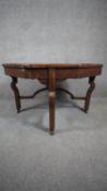 A late 19th century walnut occasional table with central satinwood floral inlay. H.47 W.74 D.73