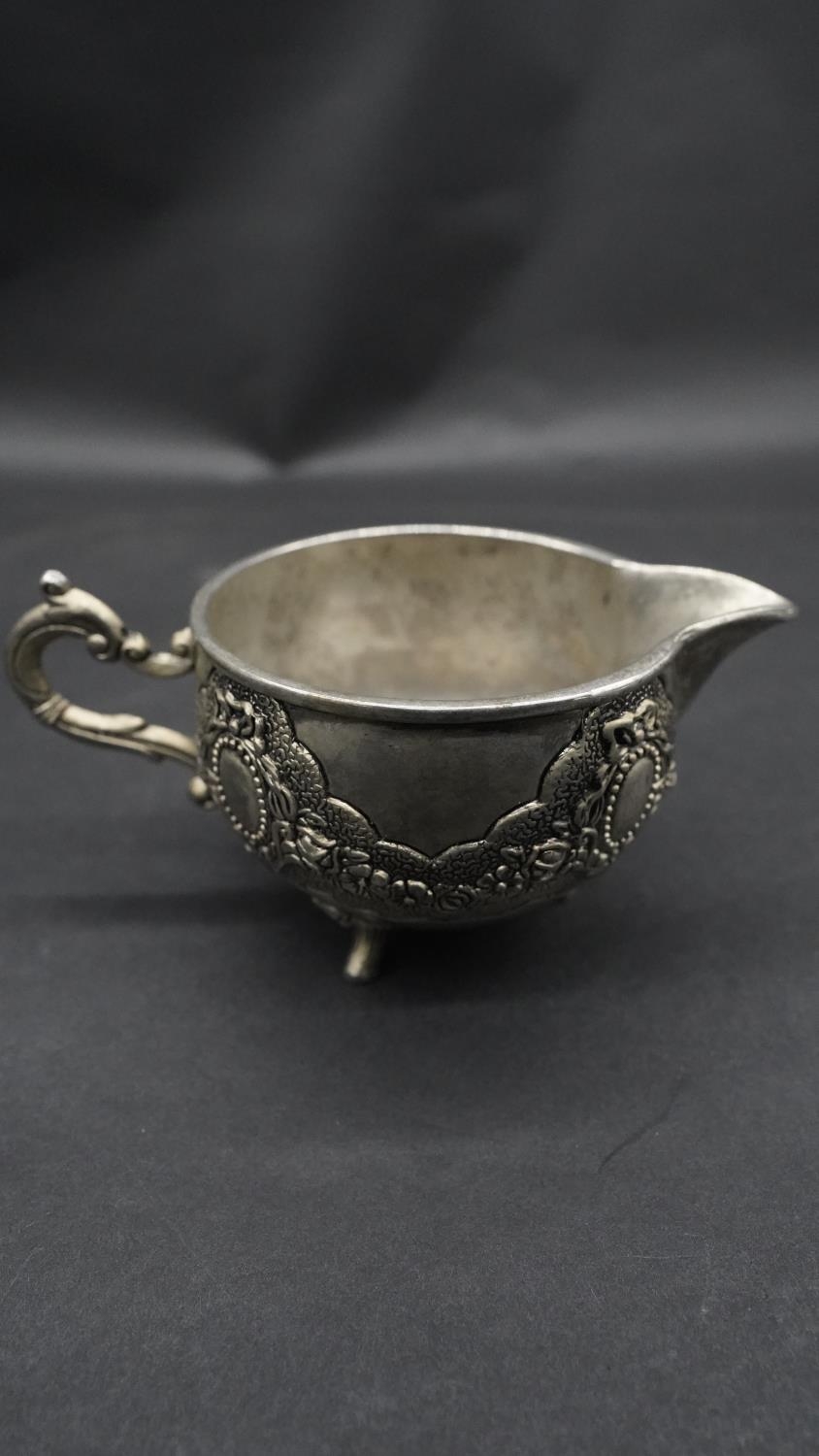A silver plate relief swag and floral design three piece Islamic coffee set, with coffee jug, - Image 11 of 11