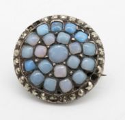 A Georgian opalescent paste stone and marcasite set white metal brooch. Secure hinged pin to the