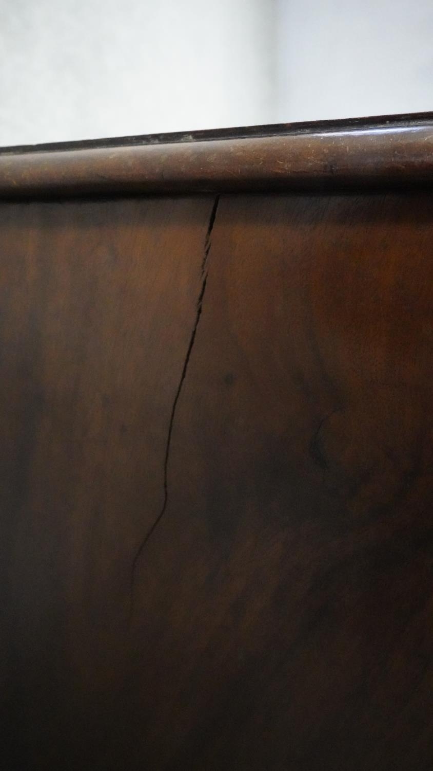 A Georgian mahogany and crossbanded bedside cabinet on shaped swept bracket feet. H.71 W.65 D.39 - Image 5 of 5