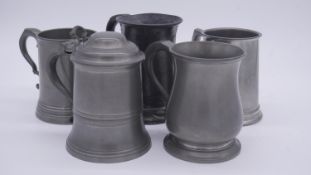 A collection of five pewter tankards. Including a 19th century pewter tankard with makers stamps.