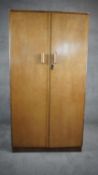 A vintage burr maple and walnut fitted compactum wardrobe. H.155 W.84 D.49