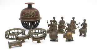 A brass miniature model of an Asian band with traditional instruments along with a brass elephant