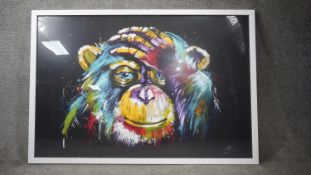 A large framed and glazed contemporary print of a coloured Chimpanzee. H.85 W.125