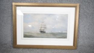 Charles Napier Hemy (1841 - 1917) A framed and glazed watercolour of a naval sailing ship with boats