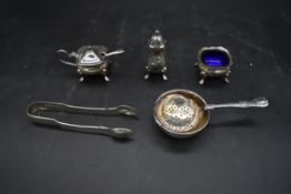A silver plated Mappin and Webb three piece condiment set along with silver plated sugar nips and