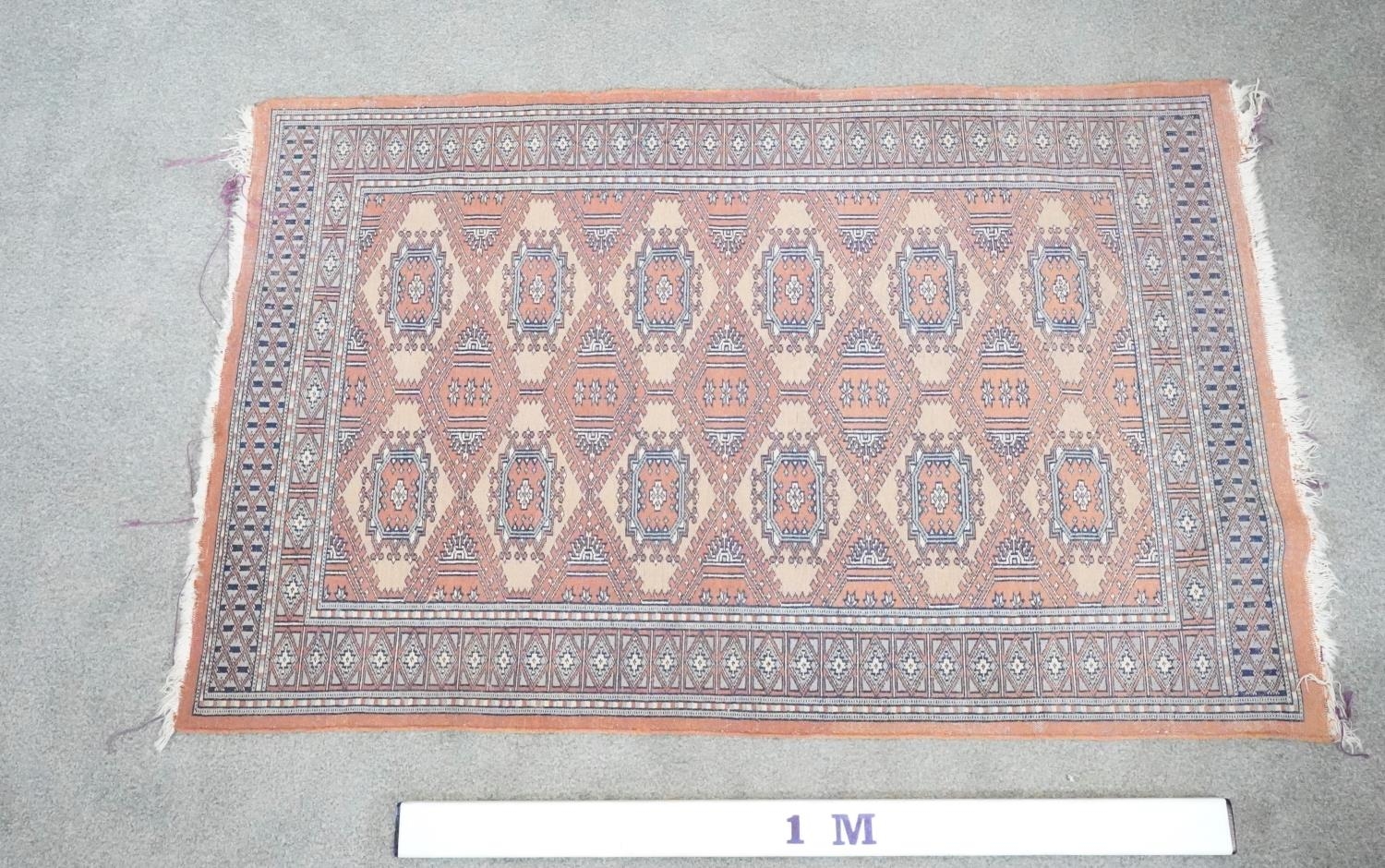 A Pakistan Bokhara rug with fawn ground and pendant motifs within a stylised border. H.91 W.150 - Image 5 of 5