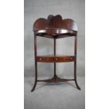 A Georgian mahogany corner washstand with shaped superstructure above undertier fitted with drawer