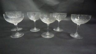 A set of six Champagne coupes with fish scale texture to the glass. H.11cm