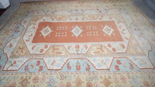 A cream ground handmade Turkish Milas carpet. L.250 W.355cm