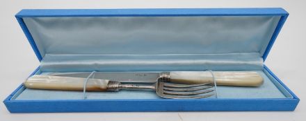 A boxed set of a Georgian silver and mother of pearl handled knife and fork. Hallmarked: