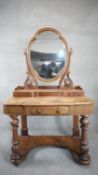 A Victorian mahogany Duchess style dressing table with shaped mirror on baluster turned platform