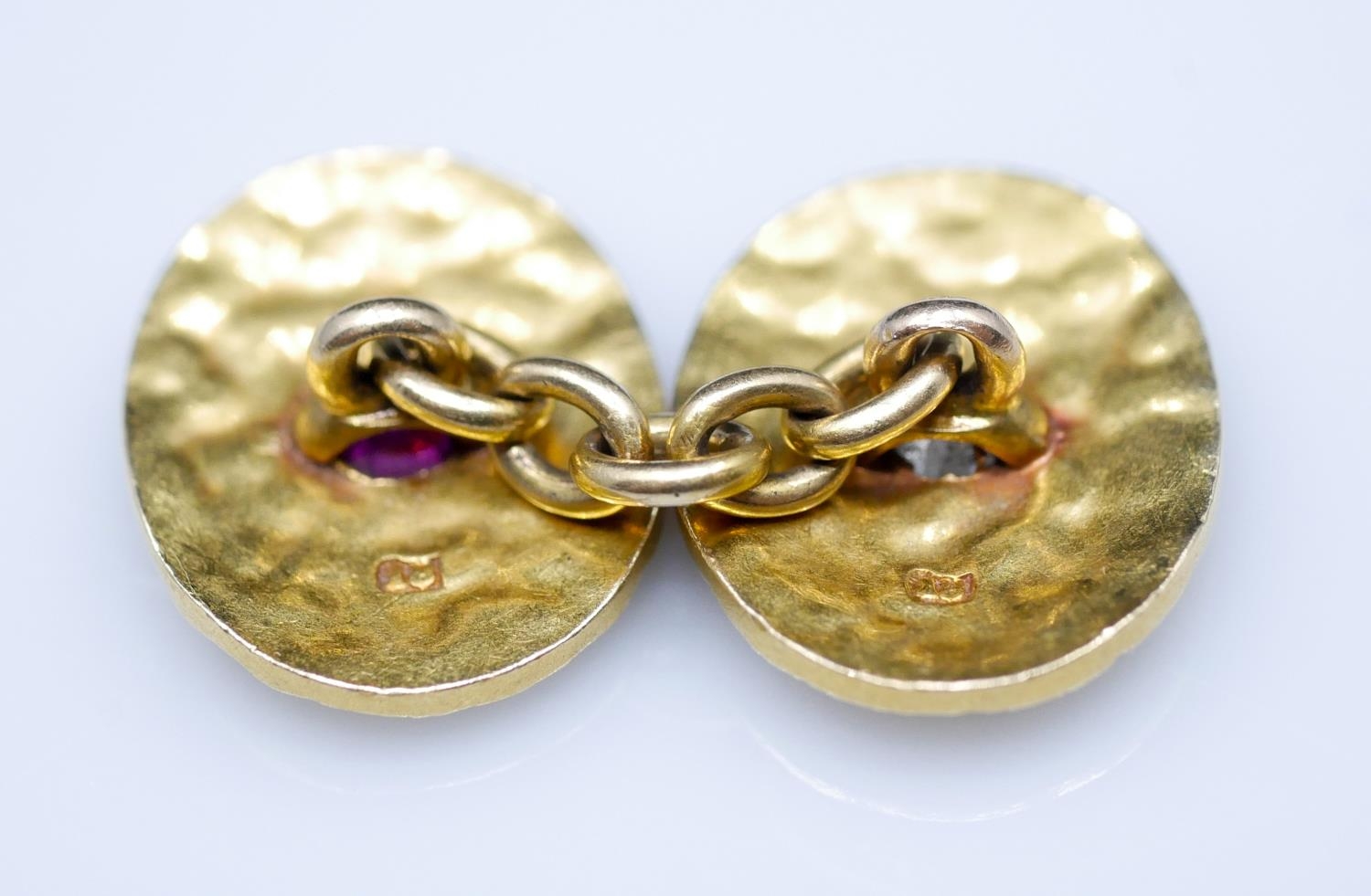 A pair of 18 carat yellow gold gemset textured cufflinks. One set with a cushion shape mixed cut - Image 7 of 8