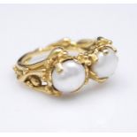 A Charles de Temple 1980's 18 carat gold and cultured pearl organic form ring. Each pearl with a