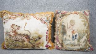 Two fine Aubusson cushions. One with a lion being trapped and one with a shepherd boy and his dog.