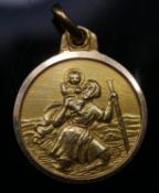 A yellow metal (tested higher than 9 carat) St Christopher with matte finish. Unmarked. L.2cm