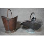 An antique copper coal bucket along with a copper helmet shaped coal scuttle. Both with swing