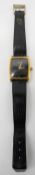 A Piaget 18 carat gold plated gentleman's mechanical wristwatch with black lizard skin strap.