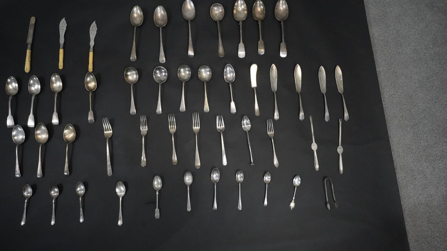 A collection of forty eight pieces of miscellaneous silver and silver plate cutlery. Including three