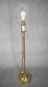 A vintage solid brass weighted base height adjustable standard lamp with silk wrapped cord. H.124