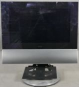 A Bang & Olufsen BeoCenter 6-26 TV. 26" screen and with remote control. H.80cm
