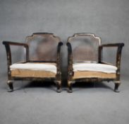 A pair of black lacquered bergere armchairs with gilt hand detailed Chinoiserie decoration. H.83cm