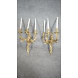 A pair of Rococo style ormolu three branch wall candelabras, wired for electricity. H.69cm