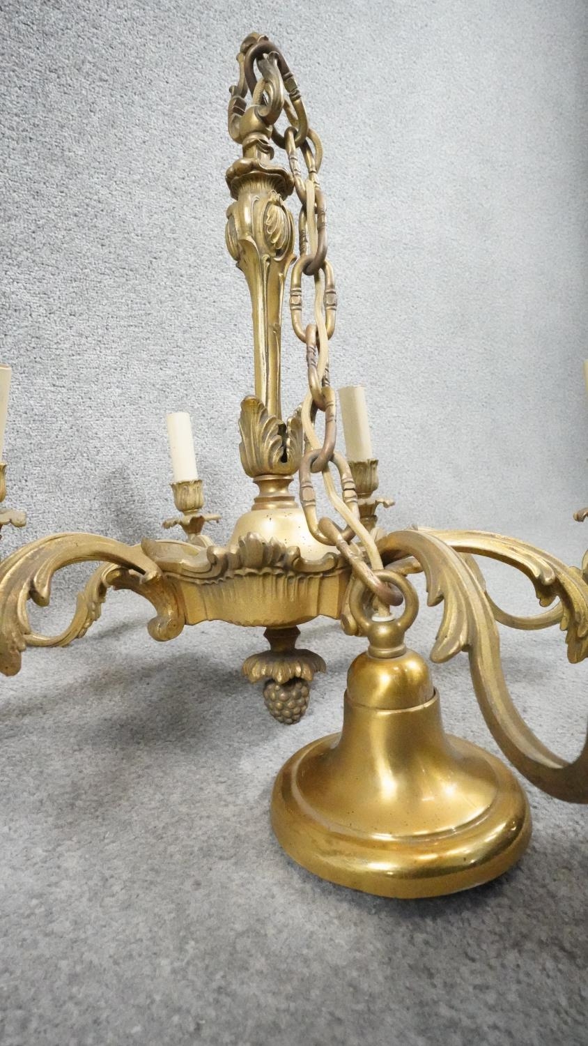 A gilt metal Rococo style eight branch ceiling candelabra. D.60cm - Image 3 of 4