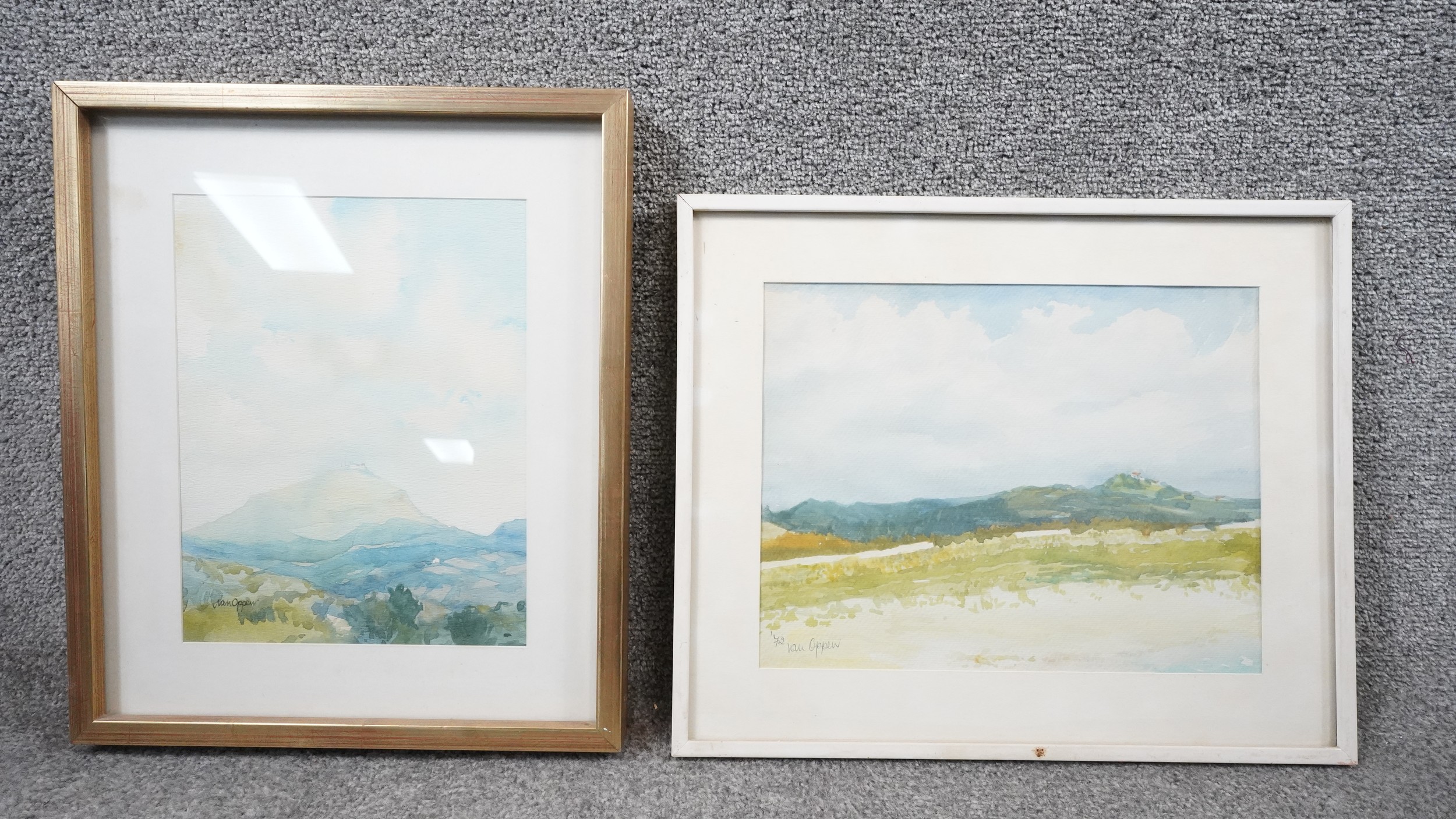 A framed and glazed watercolour, landscape with citadel in the distance, signed Van Oppen and a