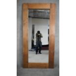 A large pine framed full length mirror. H.180 W.88cm