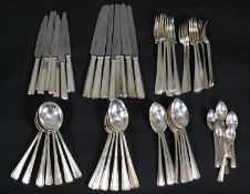 A eight person silver plated part dinner set by Roberts and Belk with geometric design. L.25cm