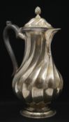 A Victorian sterling silver coffee pot with spiral design and ebony handle. Hallmarked: JBC for