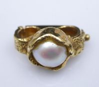 Attributed to Charles de Temple. A yellow metal (tested 18 carat) and cultured pearl clip clasp.