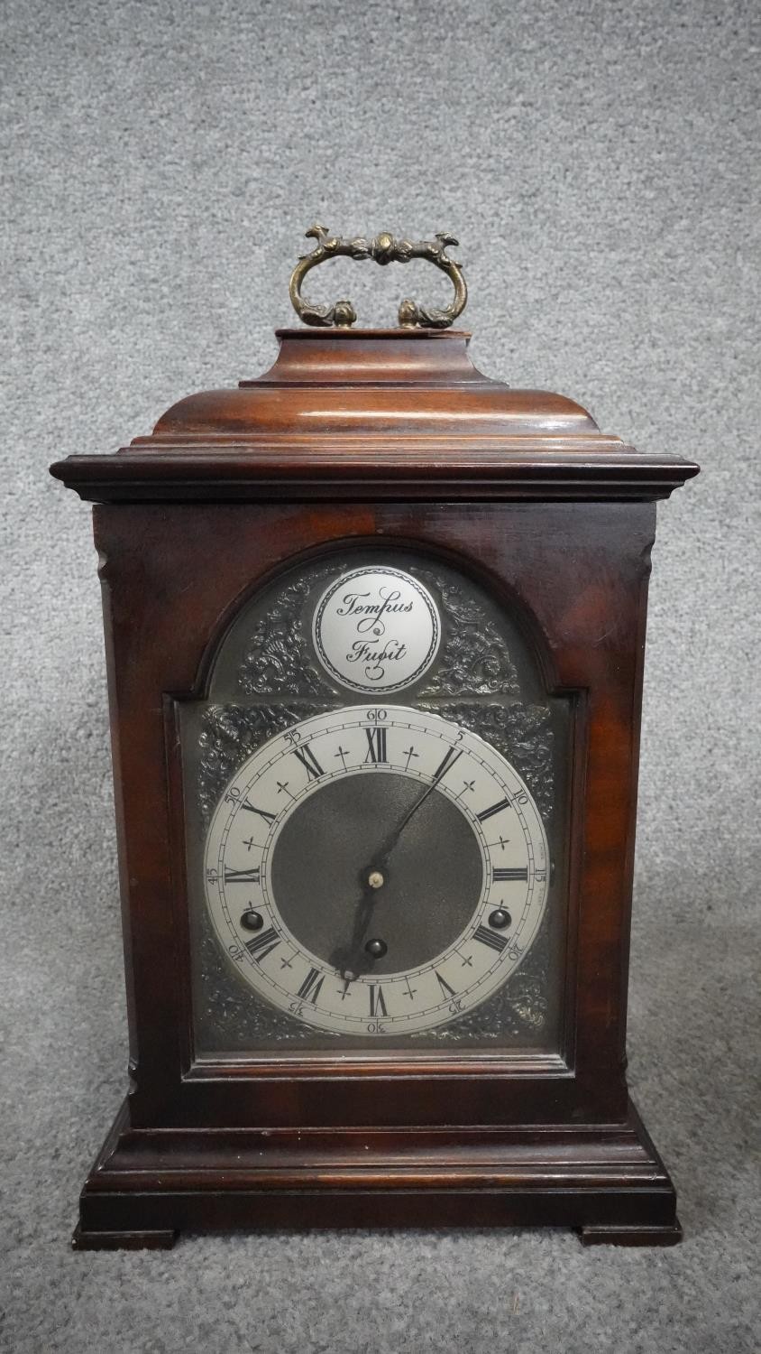 A modern 18th century style bracket clock, the dial inscribed 'Tempus Fugit', with Roman numerals