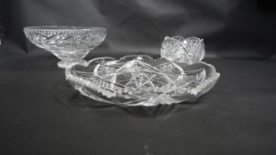 A cut lead crystal bowl along with a similar dish and a pedestal dish. D.31cm