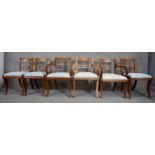 A set of six mahogany bar back Regency style dining chairs on sabre supports made up of three carver