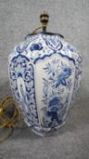 A ceramic bulbous form Majolica blue and white hand painted floral design table lamp with silk