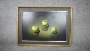 A framed still life oil on canvas of three green apples. Signed Ashley. H.67 W.92