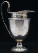 A Victorian sterling silver milk jug with beaded detailing to the edges. Hallmarked: C& Co for