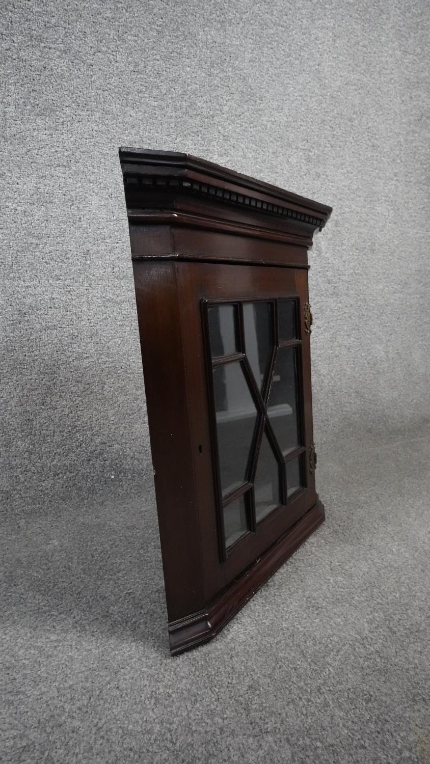 A 19th century mahogany hanging corner cabinet with astragal glazed door. H.52 W.44 D.25 (locked and - Image 5 of 7