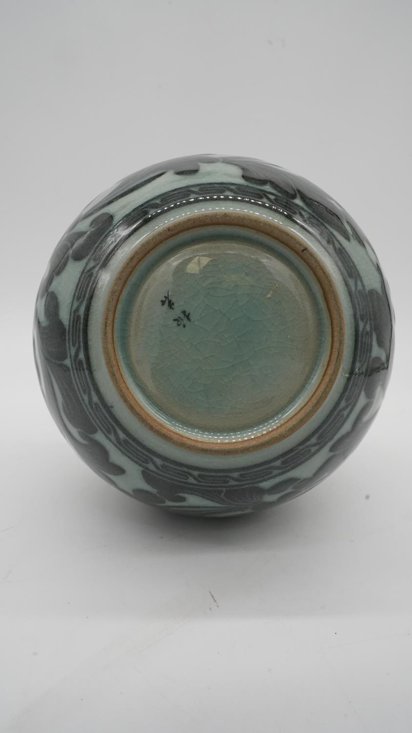 A 20th century Korean celadon glaze ceramic baluster vase with ruffled rim. Decorated with a - Image 3 of 4