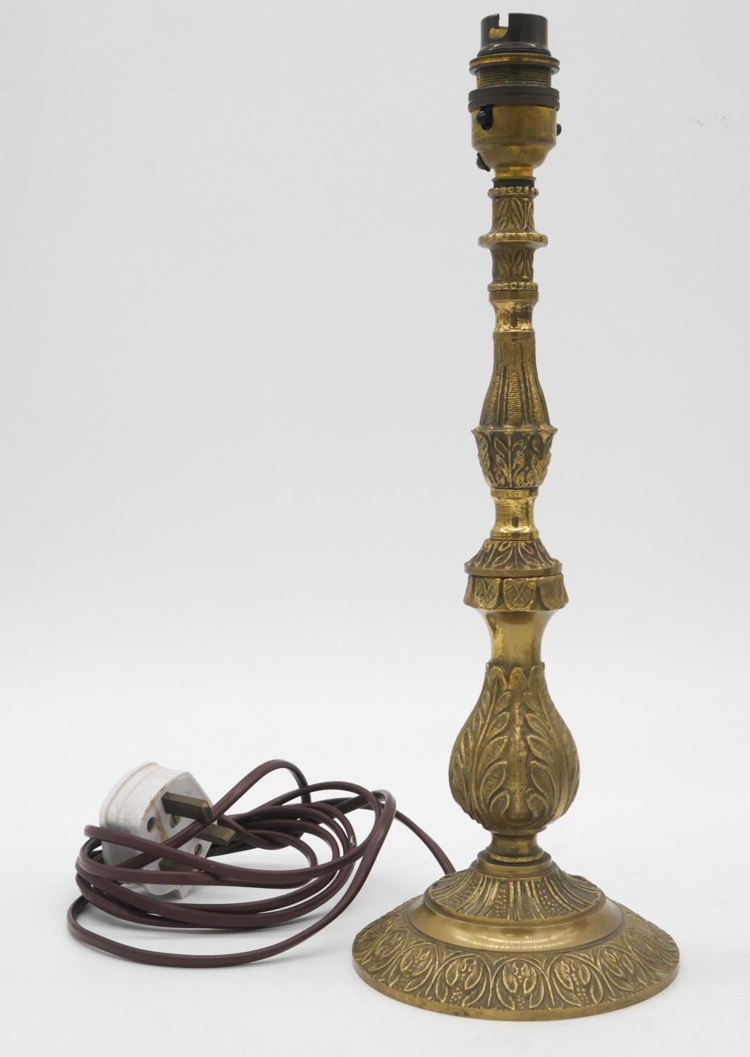 A pair of patinated brass vases with wrapped handles along with a brass foliate design table lamp. - Image 2 of 5