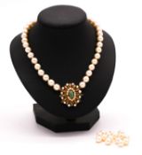 A 12 inch knotted cultured pearl choker necklace along with fifteen loose round cultured pearls. The
