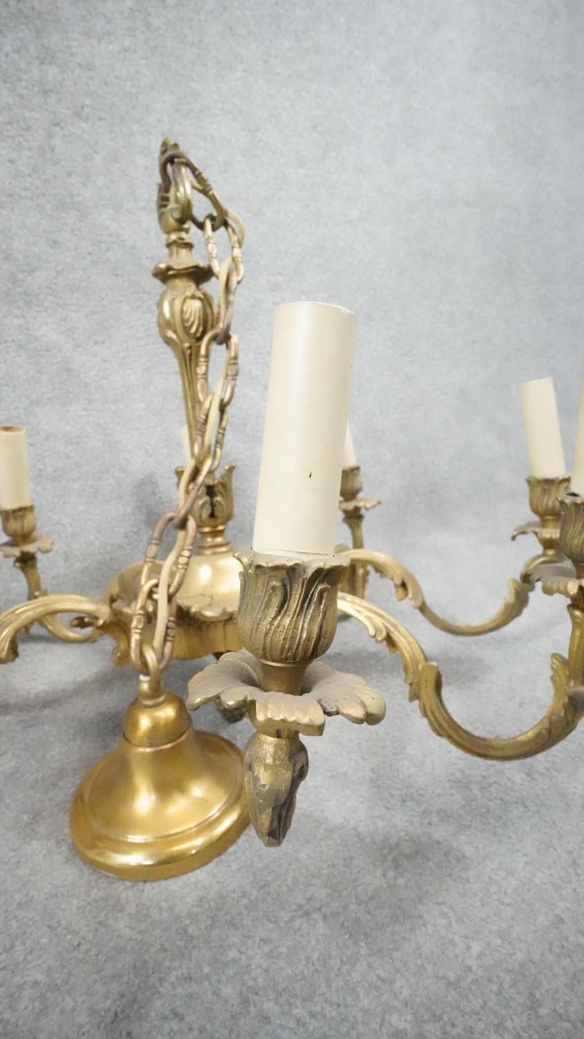 A gilt metal Rococo style eight branch ceiling candelabra. D.60cm - Image 2 of 4